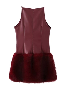 Detail of burgundy sleeveless dress featuring faux leather top and faux fur hem patchwork