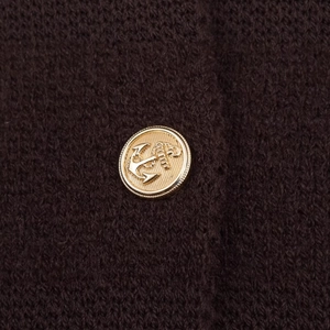 Dark brown knit cardigan featuring a detailed golden metal button with an anchor relief