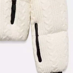 White winter padded jacket featuring unique cable knit texture and black zipper detail