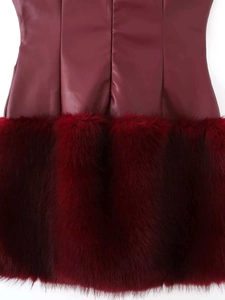 Detail of burgundy leather dress showing faux fur trim and premium matte texture