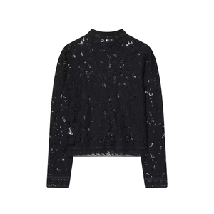 Detail of elegant black floral lace fabric on a high-neck long-sleeve blouse