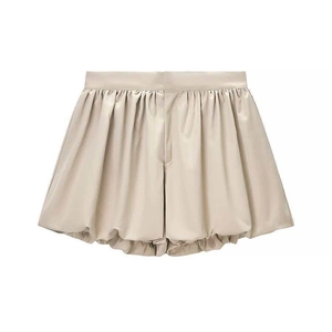 Chic champagne high-waisted puffy shorts with a subtle sheen for a stylish summer outfit