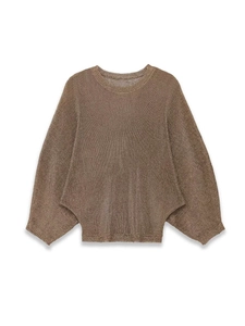 Detail shot of brown knit texture and loose batwing sleeve design with a ribbed hem