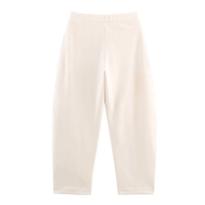 Detailed view of elastic waistband and knit cotton fabric on cream joggers