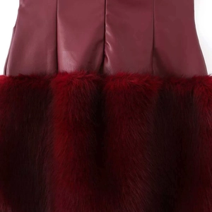 Fashionable burgundy faux leather dress with contrast plush faux fur hemline detail