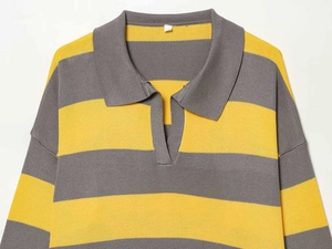 Detail view of the yellow and grey striped knit polo sweater with a wide collar design