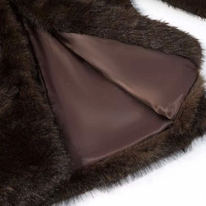 Fashionable dark brown faux fur coat for women with smooth satin lining and plush texture