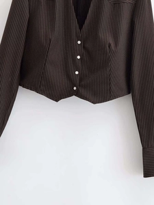 Detail of V-neck brown pinstripe cropped cardigan with four white contrast buttons