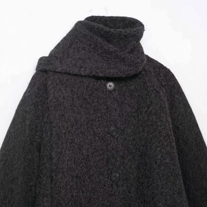 Short dark grey bouclé wool coat with a high funnel neck and large black buttons