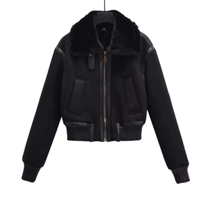 Short black winter jacket for women featuring faux fur collar and golden zipper detail