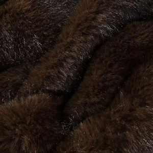 Close-up of deep brown faux fur texture showing long plush fibers and silky shine