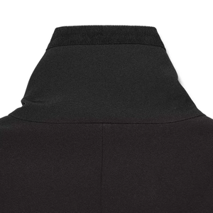 Close-up of minimalist black jacket featuring a ribbed stand collar and fine stitching details