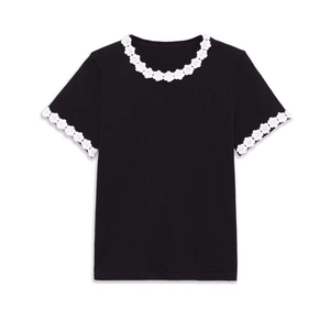 Women's black short-sleeve knit top with white crochet floral trim on neckline and cuffs