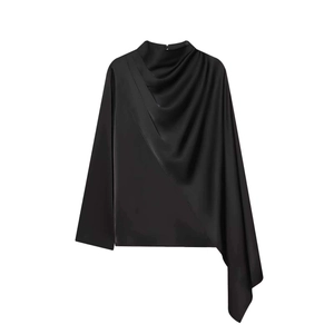 Detail of elegant black satin blouse featuring draped asymmetrical folds and mock neck