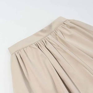 Detail of khaki pleated waistline and premium twill fabric texture for summer set