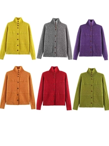 Detail view of six colorful knit cardigans with stand collars and button-down front textures