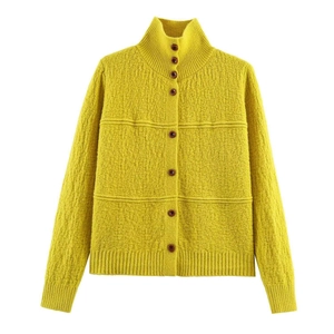 Mustard yellow textured knit cardigan with a stand collar and brown buttons
