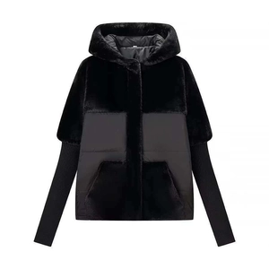 Women's black winter hooded jacket featuring mixed textures and long ribbed knit cuffs