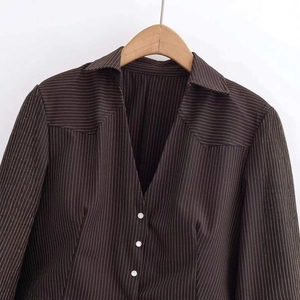 Brown pinstripe V-neck cropped cardigan with white buttons for a minimalist style