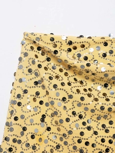 Macro detail of multicolored sequins embroidered on a vibrant yellow mini skirt fabric
