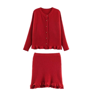 Red knit two-piece set featuring ruffled hem cardigan and matching mini skirt for women