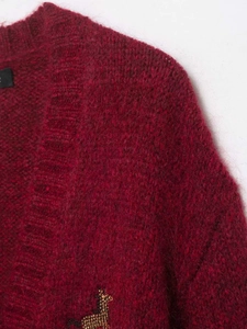 Close-up of burgundy mohair knit cardigan featuring a small beaded animal embroidery