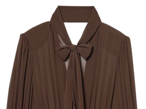 Detail of coffee brown chiffon mini dress featuring a bow tie collar and pleated texture