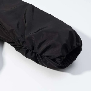 Close-up of elastic ribbed cuffs on a black winter jacket with windproof fabric
