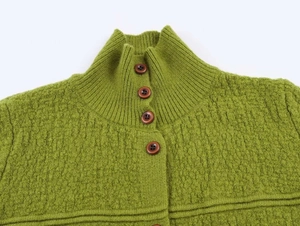 Close-up of grass green knit cardigan featuring stand-up collar and round buttons