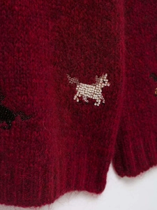 Detailed view of dark red mohair knit cardigan with hand-beaded unicorn embroidery