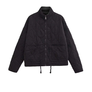 Women black quilted jacket with standing collar and large pockets on white background