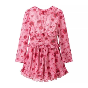 Detail view of pink floral dress featuring v-neck ruffle trim and delicate floral print