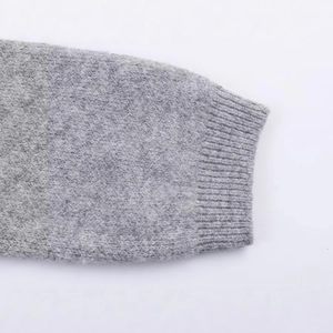 Women's light grey knitted hooded cardigan with ribbed cuff details and soft wool texture