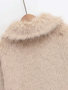 Detail of the soft faux fur texture and lapel design on the beige winter short coat