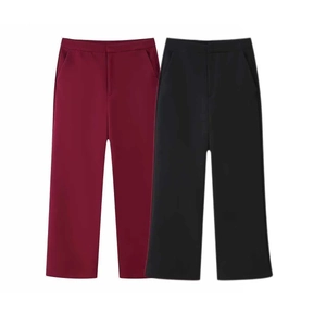 Detailed view of high-waisted wide-leg trousers in burgundy and black suit fabric