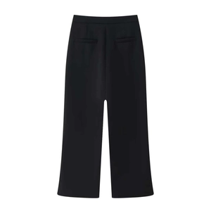 Detail view of the back of black wide-leg trousers featuring clean seams and hidden pockets