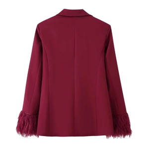 Rear view of burgundy blazer featuring elegant feather trim details on the sleeve cuffs