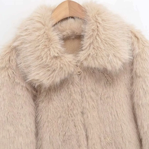 Elegant beige faux fur jacket with lapel collar shown on a wooden hanger for winter wear