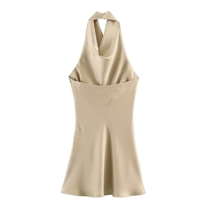 Detail of elegant backless satin dress showing champagne gold fabric and draped neck