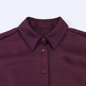 Detail view of the vintage purple shirt collar with matching buttons and textured fabric