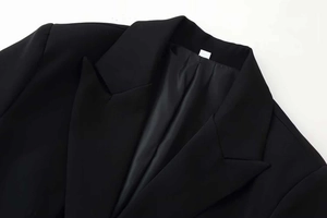 Close-up of the notch lapel and premium stitching details on this black blazer jacket