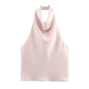 Detailed view of champagne pink satin halter top featuring a stylish cowl neck and silky finish