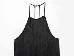 Close-up of black fringe halter top with layered tassels and adjustable thin straps