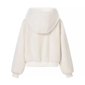 Back view of a white fuzzy hooded jacket with ribbed cuffs and soft plush texture