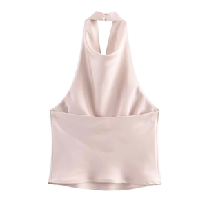Detailed view of the champagne silk halter neck top showing satin fabric texture