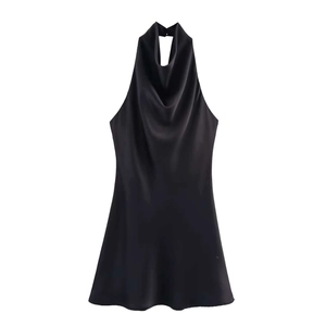 Detail view of black satin sleeveless dress with an elegant draped cowl neckline on white back