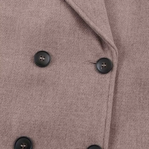 Detailed close-up of brown wool-blend jacket fabric with classic black double-breasted buttons
