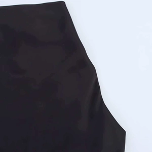 Detailed close-up of the black dress fabric showing smooth texture and high-density weave