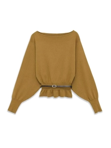 Detail of mustard yellow knit sweater with batwing sleeves and dark leather belt waist