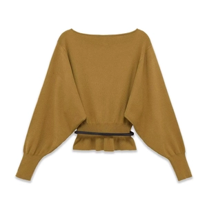 Detail of ginger knit sweater featuring a batwing sleeve design and slim waist belt